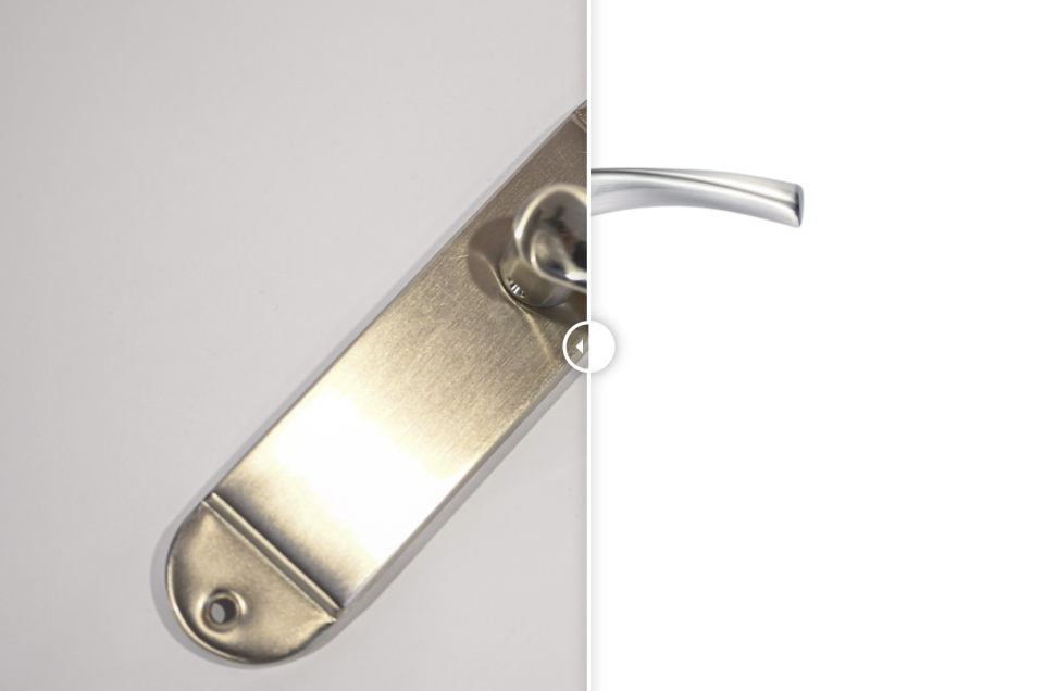 A silver door handle on a rectangular backplate appears split in half; the left side is captured through photography against a light background, whilst the right side is isolated on a plain white background.