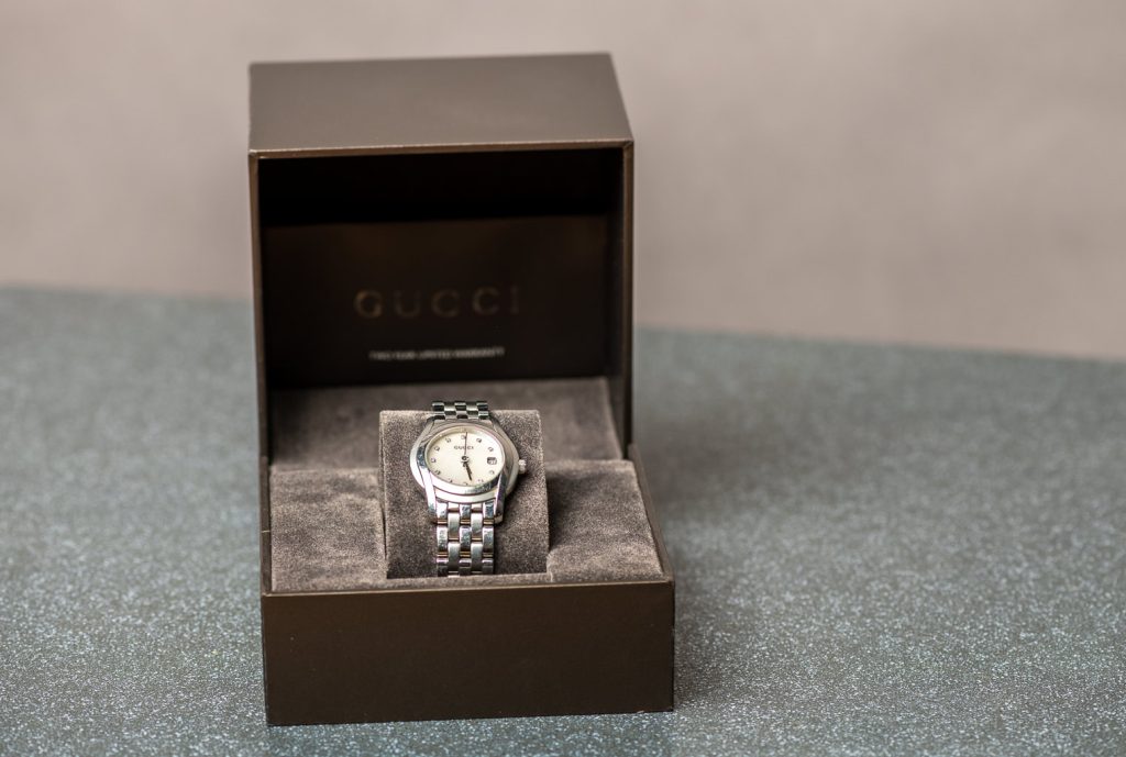 Gucgi watch in a box photographed with an iphone