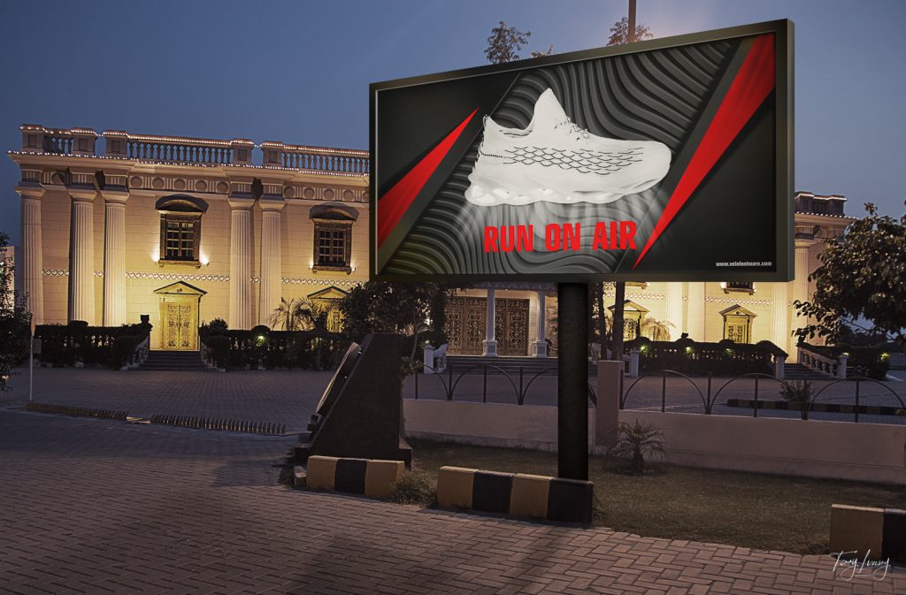 A trainer photographed and then placed on a mockup billboard in a city to show advertising photography
