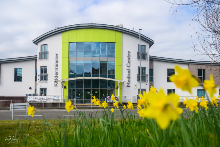 Low down view through Daffodils showing Kidderminster Medical Centre building