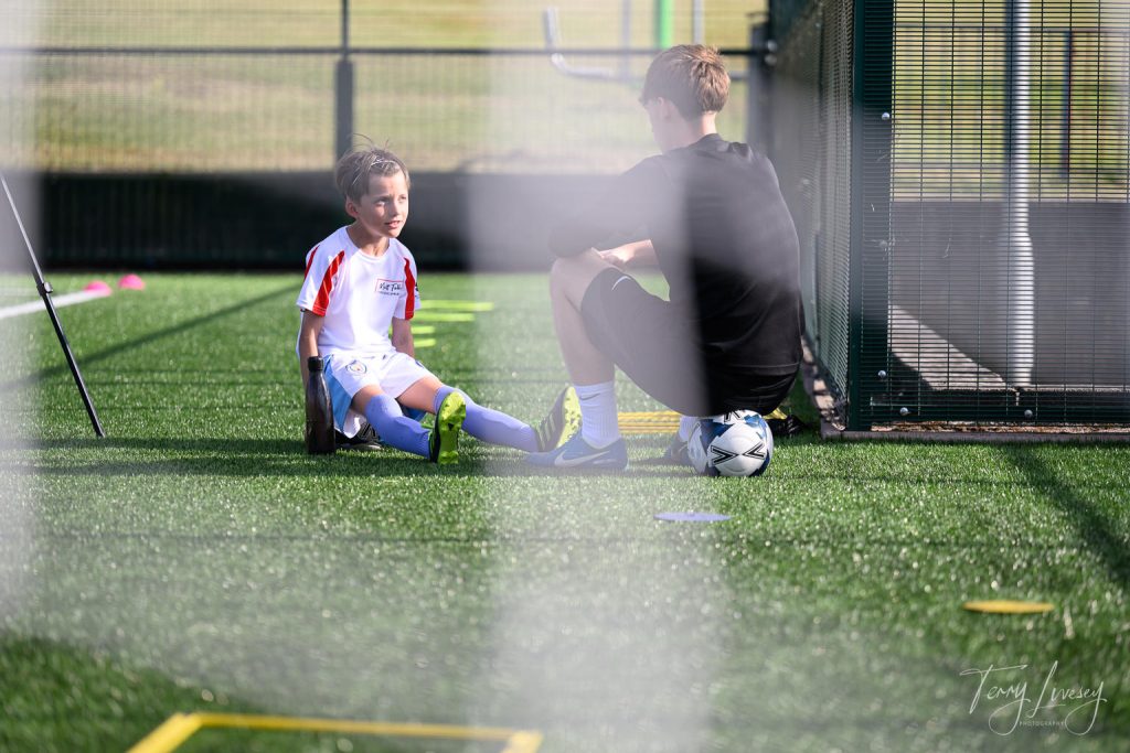 Photographs of football students on the pitch of Matt Tally Player Development.