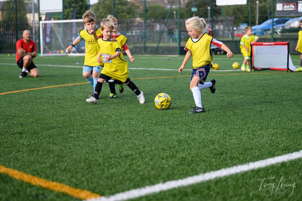 Photographs of football students on the pitch of Matt Tally Player Development.