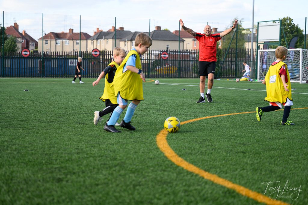 Photographs of football students on the pitch of Matt Tally Player Development.