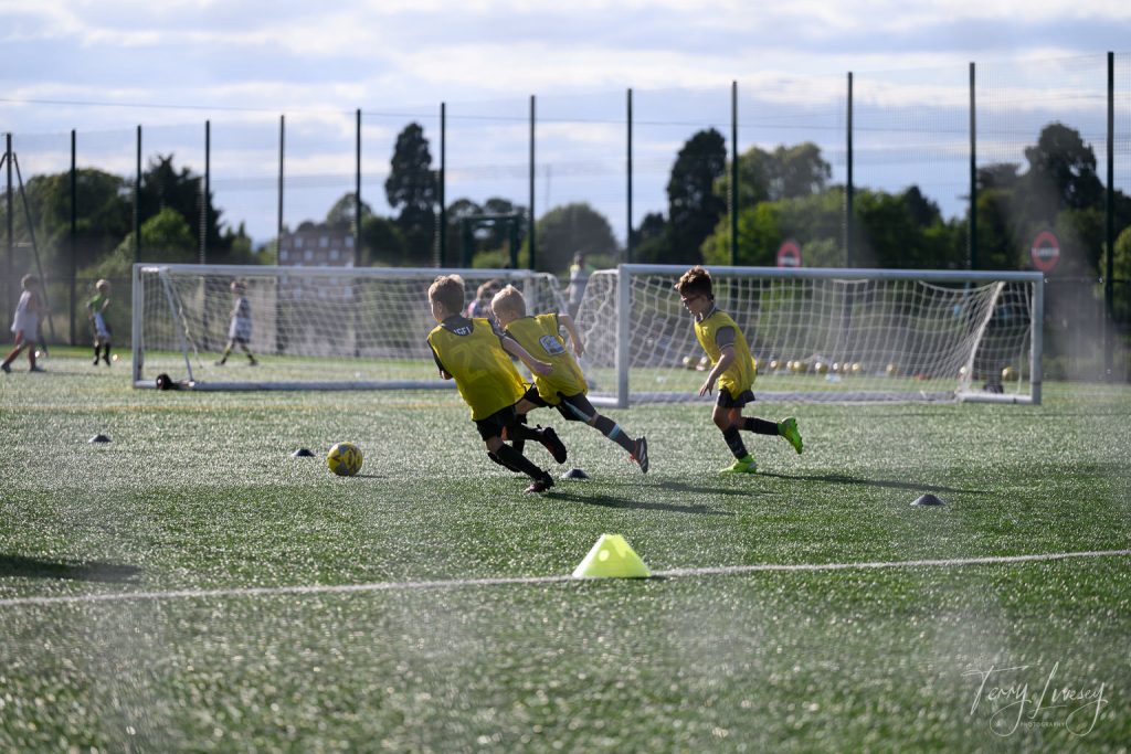 Photographs of football students on the pitch of Matt Tally Player Development.