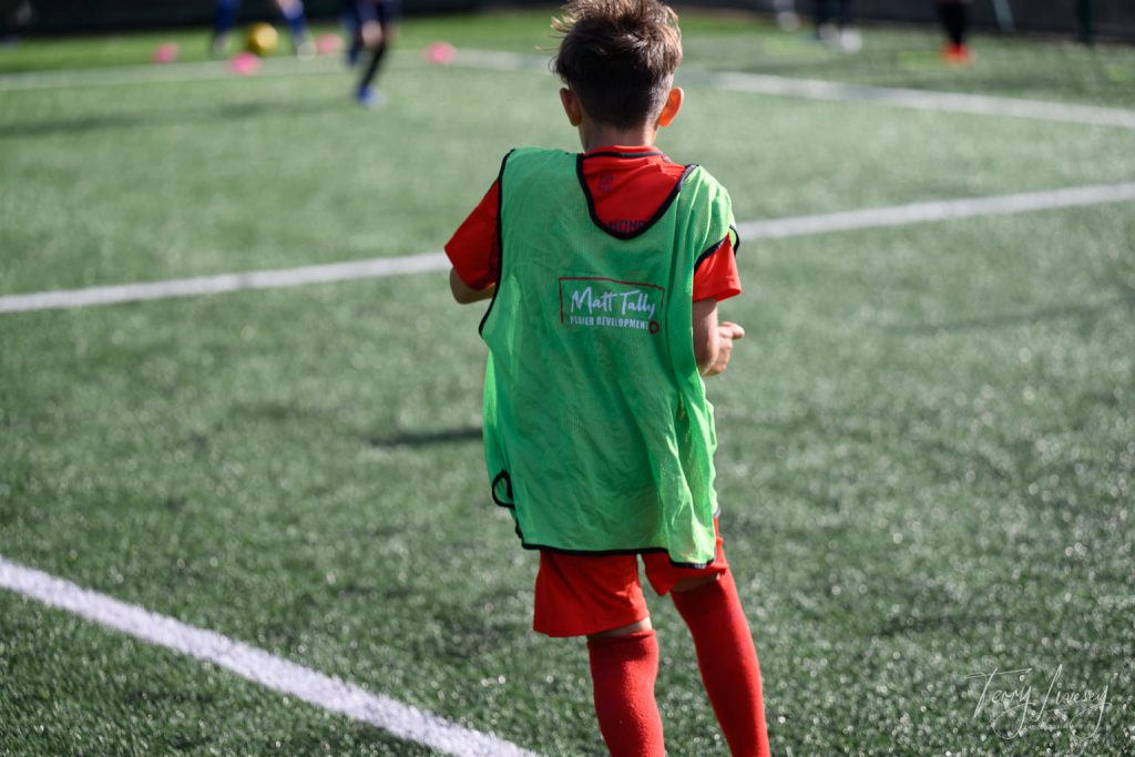 Photographs of football students on the pitch of Matt Tally Player Development.