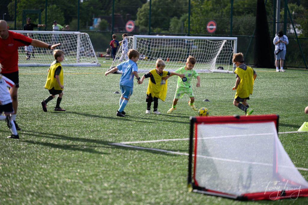 Photographs of football students on the pitch of Matt Tally Player Development.