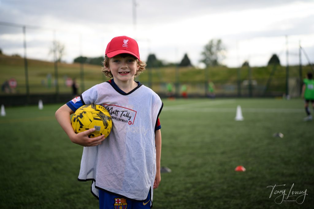Photographs of football students on the pitch of Matt Tally Player Development.