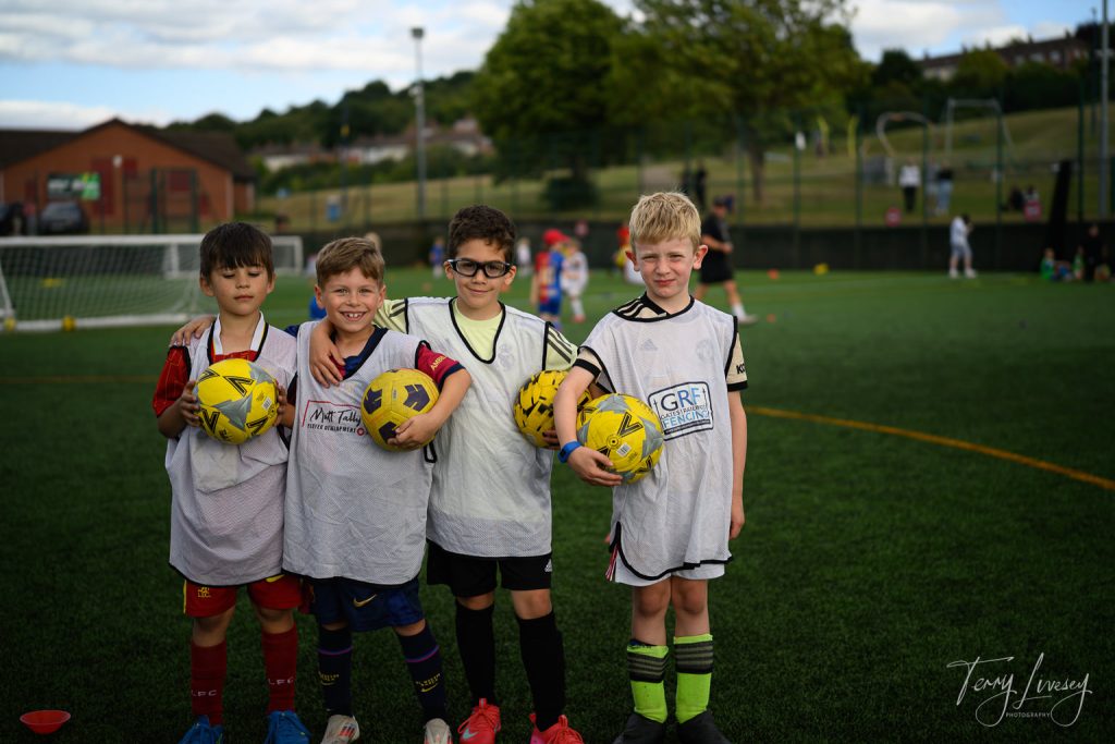 Photographs of football students on the pitch of Matt Tally Player Development.