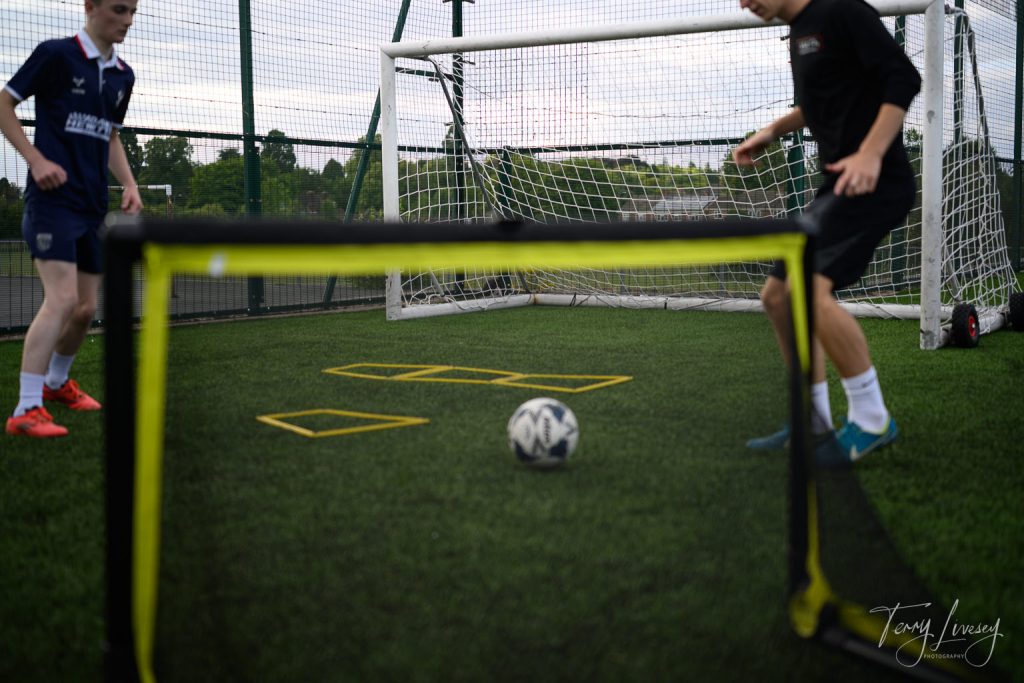 Photographs of football students on the pitch of Matt Tally Player Development.
