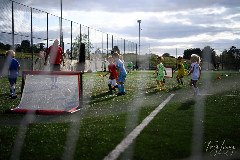 Photographs of football students on the pitch of Matt Tally Player Development.