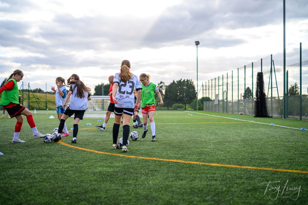 Photographs of football students on the pitch of Matt Tally Player Development.