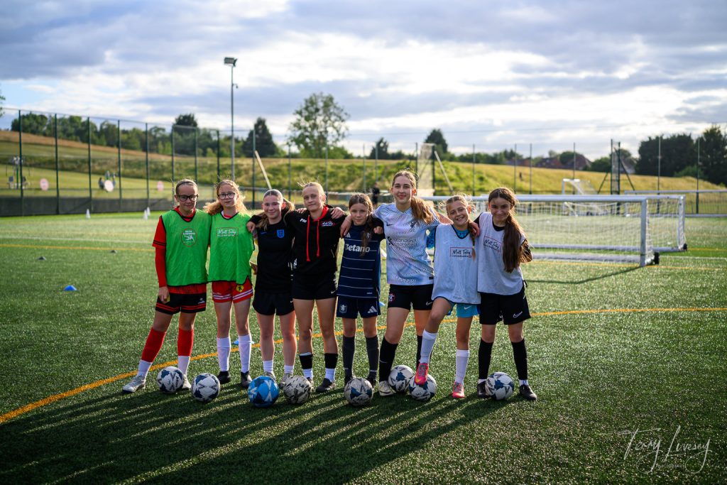 Photographs of football students on the pitch of Matt Tally Player Development.