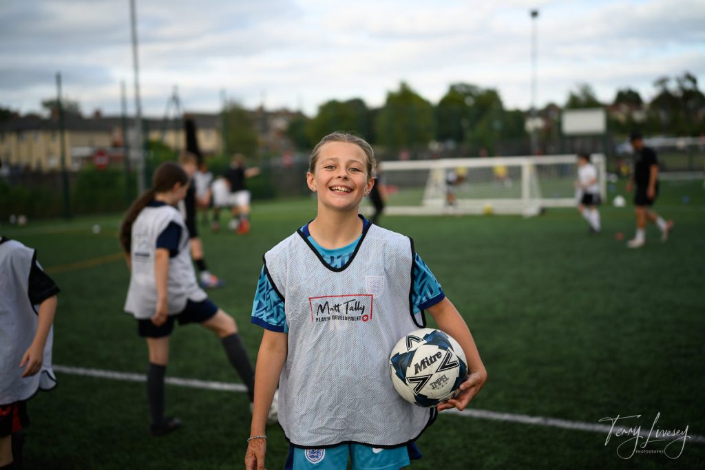 Photographs of football students on the pitch of Matt Tally Player Development.
