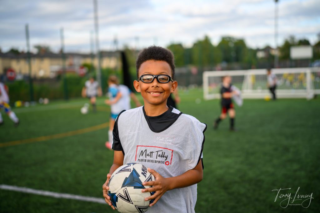 Photographs of football students on the pitch of Matt Tally Player Development.