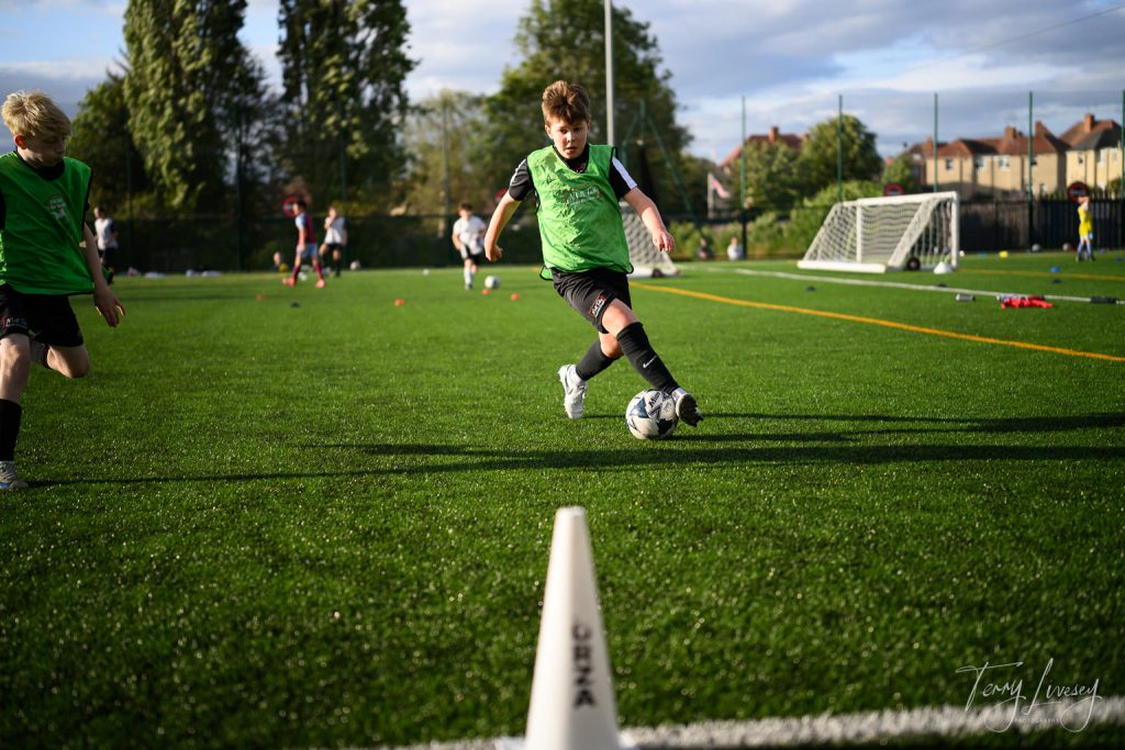 Photographs of football students on the pitch of Matt Tally Player Development.
