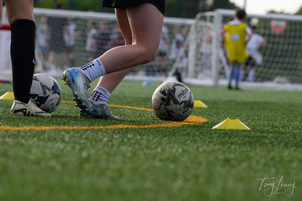 Photographs of football students on the pitch of Matt Tally Player Development.
