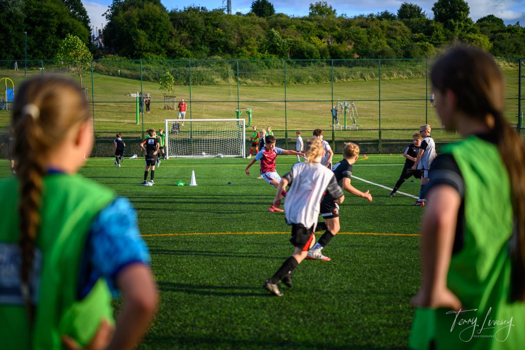 Photographs of football students on the pitch of Matt Tally Player Development.