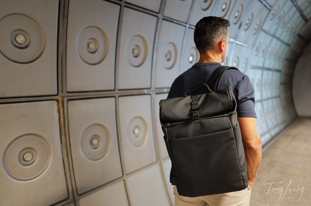 Male model with a PW3R backpack in a tube station in London