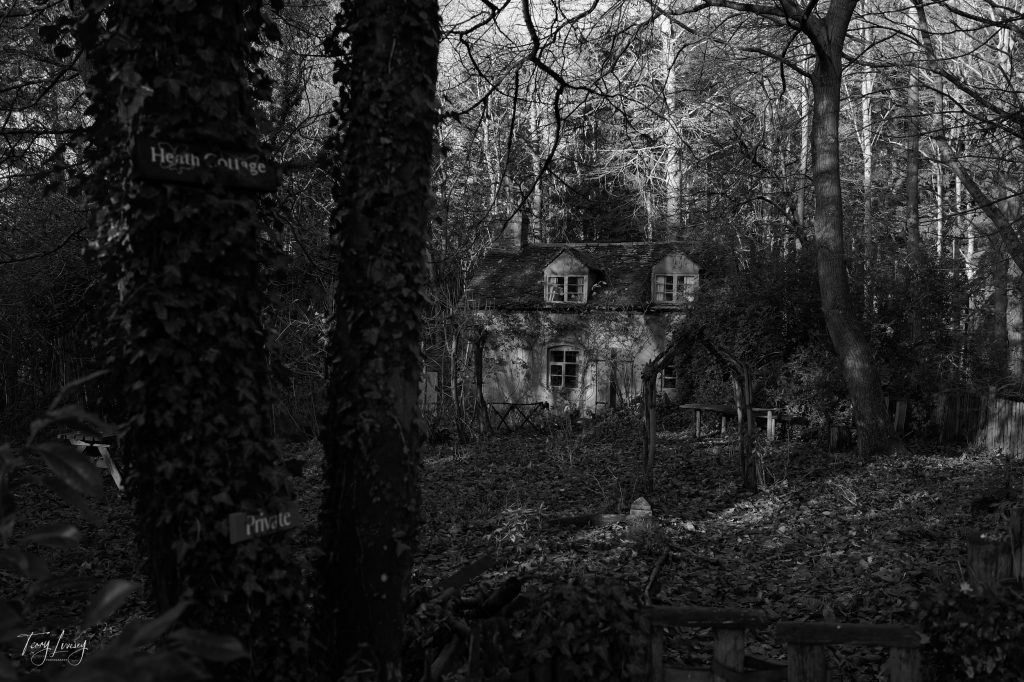 A cottage called Heath Cottage in the woods in Black and White